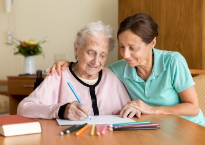 Dementia and Occupational Therapy - Home caregiver and senior adult woman